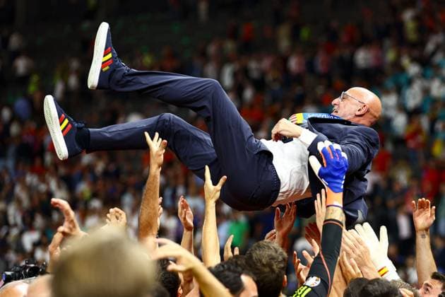 Spain manager Luis de la Fuente is thrown in the air by Spain players as they celebrate winning the 2024 UEFA European Football Championship Spain v England, UEFA European Championship, EM, Europameisterschaft 2024, Final, Football, Olympiastadion, Berlin, Germany, 14 Jul 2024 EDITORIAL USE ONLY No use with unauthorised audio, video, data, fixture lists, club league logos or live services. Online in-match use limited to 120 images, no video emulation. No use in betting, games or single club league player publications. Copyright: xKieranxMcManus Shutterstockx 14583341fg
