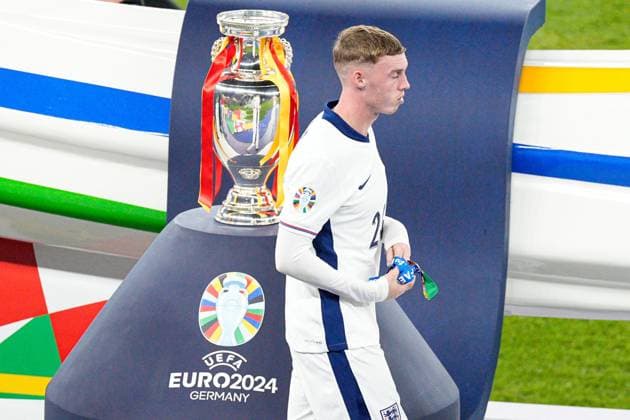 Cole Palmer of England walks past the trophy Spain v England, UEFA European Championship, EM, Europameisterschaft 2024, Final, Football, Olympiastadion, Berlin, Germany, 14 Jul 2024 EDITORIAL USE ONLY No use with unauthorised audio, video, data, fixture lists, club league logos or live services. Online in-match use limited to 120 images, no video emulation. No use in betting, games or single club league player publications. Copyright: xDavexShopland Shutterstockx 14583342ge