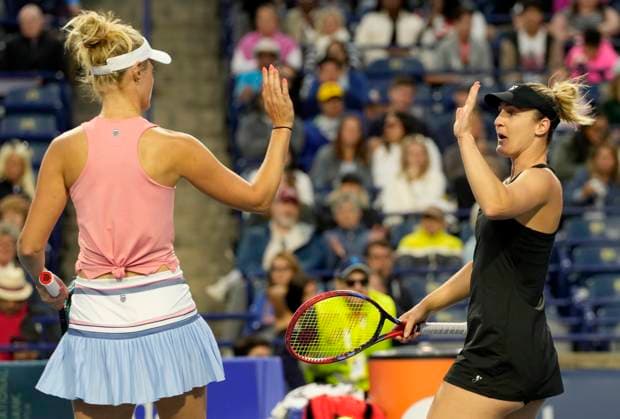 August 11, 2024, Toronto, On, CANADA: Gabriela Dabrowski, right, of Ottawa, high fives teammate Erin Routliffe, of New Zealand, after winning the first set against Leylah Fernandez, of Montreal, and teammate and sister Bianca Jolie Fernandez during women s doubles semifinal action against at the National Bank Open, in Toronto, Sunday, Aug. 11, 2024. Canada News - August 11, 2024 - ZUMAc35_ 20240811_zaf_c35_113 Copyright: xFrankxGunnx