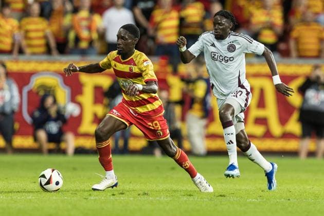 22.08.2024, Bialystok, pilka nozna, Liga Europy play-offs, Jagiellonia Bialystok - Ajax Amsterdam, N z Aurelien Nguiamba (Jagiellonia), Bertrand Traore (Ajax), fot. Tomasz Jastrzebowski Foto Olimpik 22.08.2024, Warsaw, football, UEFA Europa League play-offs, Jagiellonia Bialystok - Ajax Amsterdam In the picture: Aurelien Nguiamba (Jagiellonia), Bertrand Traore (Ajax), fot. Tomasz Jastrzebowski Foto Olimpik NEWSPIX.PL --- Newspix.pl 20240822TOJA1326