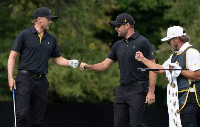 September 27, 2024, Montreal, Pq, CANADA: International team member Mackenzie Hughes of Canada, left and partner International team member Corey Conners of Canada, fist bump on the fifth hole of their second round foursome match at the Presidents Cup golf tournament at the Royal Montreal Golf Club, in Montreal, Friday, Sept. 27, 2024. Canada News - September 27, 2024 - ZUMAc35_ 20240927_zaf_c35_128 Copyright: xChristinnexMuschix