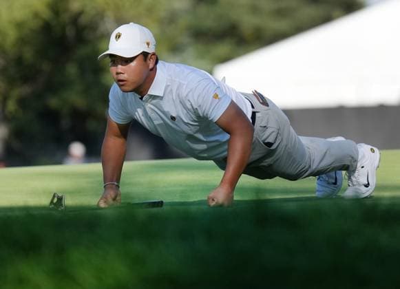 September 28, 2024, Montreal, Pq, Canada: International team member Tom Kim of South Korea, lines up a putt on the 5th hole during their fourth round foursomes match at the Presidents Cup golf tournament at Royal Montreal Golf Club, in Montreal, Saturday, Sept. 28, 2024. Tom Kim, - ZUMAc35_ 20240928_zaf_c35_127 Copyright: xNathanxDenettex
