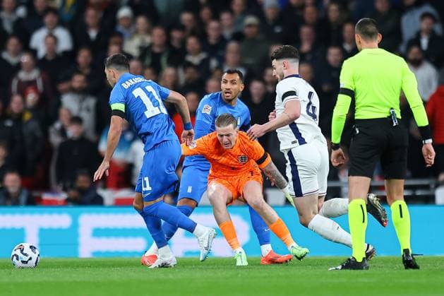 Jordan Pickford of England makes an error under pressure from Vangelis Pavlidis of Greece almost leading to an opening goal for Greece England v Greece, UEFA Nations League, League B, Group 2, Football, Wembley Stadium, London, UK, 10 Oct 2024 EDITORIAL USE ONLY No use with unauthorised audio, video, data, fixture lists, club league logos or live services. Online in-match use limited to 120 images, no video emulation. No use in betting, games or single club league player publications. Copyright: xMichaelxZemanek Shutterstockx 14767424as