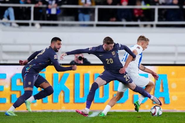 Cole Palmer of England and Topi Keskinen of Finland Finland v England, UEFA Nations League, League B, Group 2, Football, Helsinki Olympic Stadium, Helsinki, Finland, 13 Oct 2024 EDITORIAL USE ONLY No use with unauthorised audio, video, data, fixture lists, club league logos or live services. Online in-match use limited to 120 images, no video emulation. No use in betting, games or single club league player publications. Copyright: xJavierxGarcia Shutterstockx 14776794cy