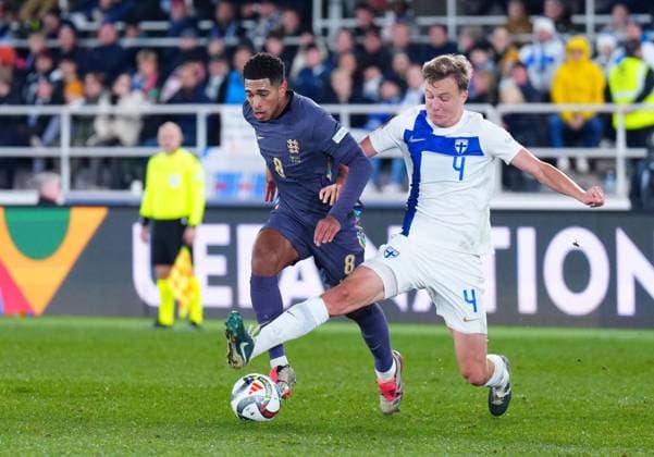 Jude Bellingham of England battles with Robert Ivanov of Finland Finland v England, UEFA Nations League, League B, Group 2, Football, Helsinki Olympic Stadium, Helsinki, Finland, 13 Oct 2024 EDITORIAL USE ONLY No use with unauthorised audio, video, data, fixture lists, club league logos or live services. Online in-match use limited to 120 images, no video emulation. No use in betting, games or single club league player publications. Copyright: xJavierxGarcia Shutterstockx 14776794iq