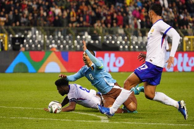 Aurelien Tchouameni of France receives a red card for a foul on Youri Tielemans of Belgium Belgium v France, UEFA Nations League, League A, Group 2, Football, Stade Roi Baudouin, Brussels, Belgium, 14 Oct 2024 EDITORIAL USE ONLY No use with unauthorised audio, video, data, fixture lists, club league logos or live services. Online in-match use limited to 120 images, no video emulation. No use in betting, games or single club league player publications. Copyright: xDavexWinter Shutterstockx 14783126bi