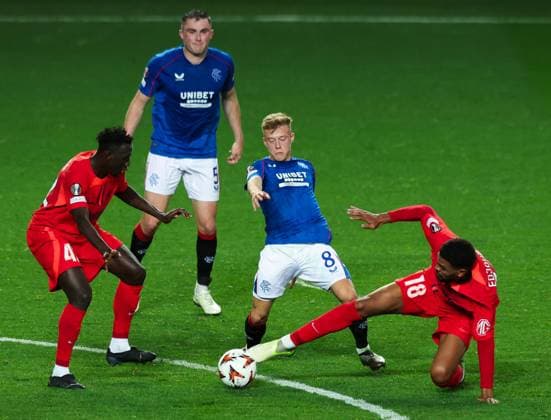 Connor Barron of Rangers in action with Malcolm Edjouma of FCSB during the Europa League group phase match at Ibrox Stadium, Glasgow. Rangers v FCSB, UEFA Europa League, Group Stage, Football, Ibrox Stadium, Glasgow, Scotland, UK, 24 Oct 2024 EDITORIAL USE ONLY No use with unauthorised audio, video, data, fixture lists, club league logos or live services. Online in-match use limited to 120 images, no video emulation. No use in betting, games or single club league player publications. Copyright: xLukexNickerson RangersxFC Shutterstockx 14816728ai