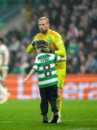 A young Celtic fan runs on to the pitch during the match with Celtic goalkeeper Kasper Schmeichel. Celtic v RB Leipzig, UEFA Champions League, Group Stage, Football, Celtic Park, Glasgow, Scotland, UK - 05 Nov 2024 EDITORIAL USE ONLY No use with unauthorised audio, video, data, fixture lists, club league logos or live services. Online in-match use limited to 120 images, no video emulation. No use in betting, games or single club league player publications. Copyright: xStuartxWallace Shutterstockx 14863772bx