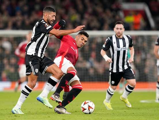 Manchester, England, 7th November 2024. Casemiro of Manchester United, ManU with PAOK™s Tarik Tissoudali during the UEFA Europa League match at Old Trafford, Manchester. Picture credit should read: Andrew Yates Sportimage EDITORIAL USE ONLY. No use with unauthorised audio, video, data, fixture lists, club league logos or live services. Online in-match use limited to 120 images, no video emulation. No use in betting, games or single club league player publications. SPI-3442-0025