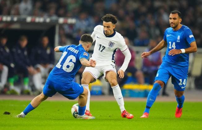Curtis Jones of England looks to get past Christos Zafeiris of Greece as Vangelis Pavlidis looks on Greece v England, UEFA Nations League, League B, Group 2, Football, Olympic Stadium, Athens, Greece - 14 Nov 2024 EDITORIAL USE ONLY No use with unauthorised audio, video, data, fixture lists, club league logos or live services. Online in-match use limited to 120 images, no video emulation. No use in betting, games or single club league player publications. Copyright: xJavierxGarcia Shutterstockx 14902321ee