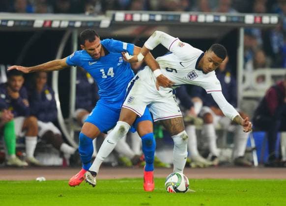 Vangelis Pavlidis of Greece battles with Ezri Konsa of England Greece v England, UEFA Nations League, League B, Group 2, Football, Olympic Stadium, Athens, Greece - 14 Nov 2024 EDITORIAL USE ONLY No use with unauthorised audio, video, data, fixture lists, club league logos or live services. Online in-match use limited to 120 images, no video emulation. No use in betting, games or single club league player publications. Copyright: xJavierxGarcia Shutterstockx 14902321fp