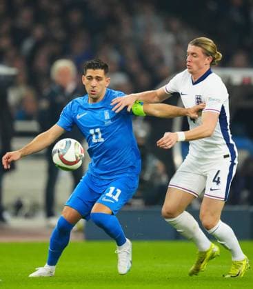 Tasos Bakasetas of Greece battles with Conor Gallagher of England Greece v England, UEFA Nations League, League B, Group 2, Football, Olympic Stadium, Athens, Greece - 14 Nov 2024 EDITORIAL USE ONLY No use with unauthorised audio, video, data, fixture lists, club league logos or live services. Online in-match use limited to 120 images, no video emulation. No use in betting, games or single club league player publications. Copyright: xJavierxGarcia Shutterstockx 14902321fw