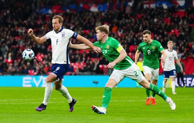 Harry Kane of England under pressure from Nathan Collins of the Republic of Ireland England v Ireland, UEFA Nations League, League B, Group 2, Football, Wembley Stadium, London, UK - 17 Nov 2024 EDITORIAL USE ONLY No use with unauthorised audio, video, data, fixture lists, club league logos or live services. Online in-match use limited to 120 images, no video emulation. No use in betting, games or single club league player publications. Copyright: xJavierxGarcia Shutterstockx 14902695db