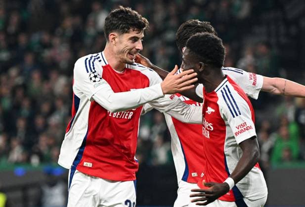 Kai Havertz of Arsenal celebrates scoring the goal for their side with their teammates to make it 2-0 Sporting Lisbon v Arsenal, UEFA Champions League, Group Stage, Football, Estadio Jose Alvalade, Lisbon, Portugal - 26 Nov 2024 EDITORIAL USE ONLY No use with unauthorised audio, video, data, fixture lists, club league logos or live services. Online in-match use limited to 120 images, no video emulation. No use in betting, games or single club league player publications. Copyright: xZedxJameson Shutterstockx 14940177av