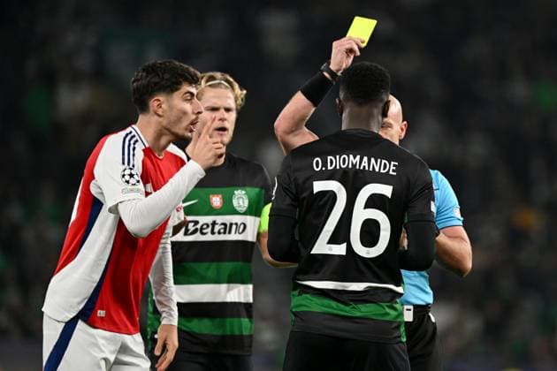 Ousmane Diomande of Sporting CP receives an early yellow card from Referee Szymon Marciniak Sporting Lisbon v Arsenal, UEFA Champions League, Group Stage, Football, Estadio Jose Alvalade, Lisbon, Portugal - 26 Nov 2024 EDITORIAL USE ONLY No use with unauthorised audio, video, data, fixture lists, club league logos or live services. Online in-match use limited to 120 images, no video emulation. No use in betting, games or single club league player publications. Copyright: xZedxJameson Shutterstockx 14940177cz