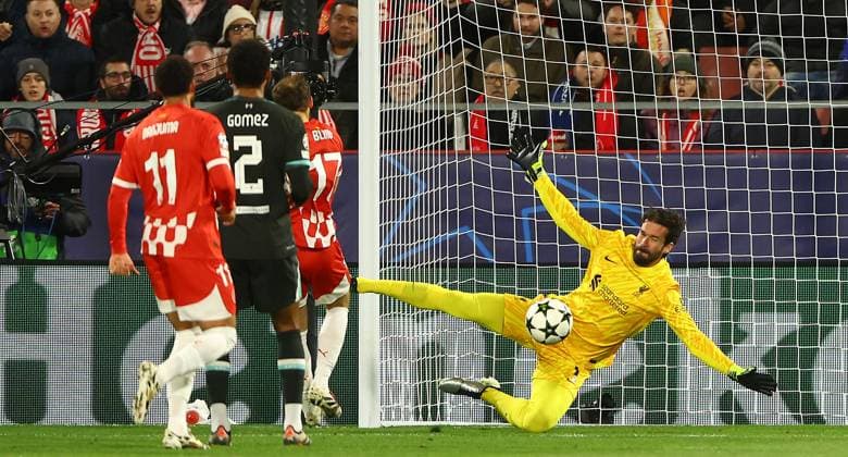 Alisson Becker of Liverpool makes a save from Daley Blind of Girona Girona v Liverpool, UEFA Champions League, Group Stage, Football, Estadi Montilivi, Girona, Spain - 10 Dec 2024 EDITORIAL USE ONLY No use with unauthorised audio, video, data, fixture lists, club league logos or live services. Online in-match use limited to 120 images, no video emulation. No use in betting, games or single club league player publications. Copyright: xKieranxMcManus Shutterstockx 14984460r