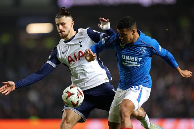 Radu Dragusin of Tottenham Hotspur and Hamza Igamane of Rangers during the Europa League group phase match at Ibrox Stadium, Glasgow. Rangers v Tottenham Hotspur, UEFA Europa League, Football, Ibrox Stadium, Glasgow, Scotland, UK - 12 Dec 2024 EDITORIAL USE ONLY No use with unauthorised audio, video, data, fixture lists, club league logos or live services. Online in-match use limited to 120 images, no video emulation. No use in betting, games or single club league player publications. Copyright: xKirkxO Rourke RangersxFC Shutterstockx 14998166t