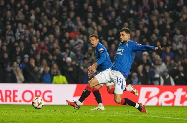 Nedim Bajrami of Rangers shoots at goal but his shot is saved by Tottenham Hotspur goalkeeper Fraser Forster. Rangers v Tottenham Hotspur, UEFA Europa League, Group Stage, Football, Ibrox Stadium, Glasgow, Scotland - 12 Dec 2024 EDITORIAL USE ONLY No use with unauthorised audio, video, data, fixture lists, club league logos or live services. Online in-match use limited to 120 images, no video emulation. No use in betting, games or single club league player publications. Copyright: xStuartxWallace Shutterstockx 14985154bv