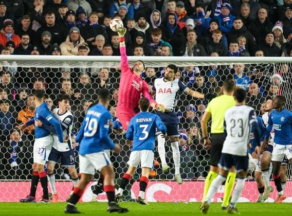 Rangers goalkeeper Jack Butland punches the ball away from goal under pressure from Dominic Solanke of Tottenham Hotspur. Rangers v Tottenham Hotspur, UEFA Europa League, Group Stage, Football, Ibrox Stadium, Glasgow, Scotland - 12 Dec 2024 EDITORIAL USE ONLY No use with unauthorised audio, video, data, fixture lists, club league logos or live services. Online in-match use limited to 120 images, no video emulation. No use in betting, games or single club league player publications. Copyright: xStuartxWallace Shutterstockx 14985154dj