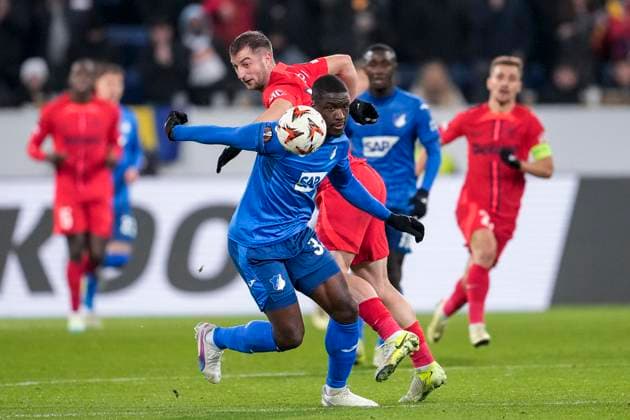 v.li.: Stanley Pierre Nsoki (N Soki, Hoffenheim, 34), Daniel Popa (FCSB Bukarest, 19), Zweikampf, Spielszene, Duell, duel, tackle, tackling, Dynamik, Action, Aktion, 12.12.2024, Sinsheim (Deutschland), Fussball, UEFA Europa League, Gruppenphase, TSG 1899 Hoffenheim - FCSB Bukarest, 12.12.2024, Sinsheim (Deutschland), Fussball, UEFA Europa League, Gruppenphase, TSG 1899 Hoffenheim - FCSB Bukarest, DFB DFL REGULATIONS PROHIBIT ANY USE OF PHOTOGRAPHS AS IMAGE SEQUENCES AND OR QUASI-VIDEO.