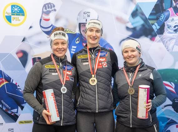 photographer: FIL Michael Kristen 28.12.2024 Austrian Championships, Olympia Ice Track Innsbruck-Igls, Tirol, Austria (AUT), Award Ceremony, Women™s Singles, picture: Lisa Schulte (AUT, 2nd place), Madeleine Egle (AUT, 1st place), Dorothea Schwarz (AUT, 3rd place)