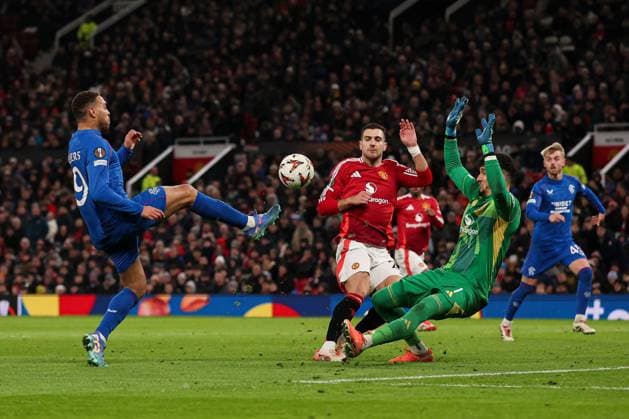 Cyriel Dessers of Rangers shoots at goal but fails to score as their shot is saved by Altay Bayindir of Manchester United, ManU Manchester United v Rangers, UEFA Europa League, Group Stage, Football, Old Trafford, Manchester, UK - 23 Jan 2025 EDITORIAL USE ONLY No use with unauthorised audio, video, data, fixture lists, club league logos or live services. Online in-match use limited to 120 images, no video emulation. No use in betting, games or single club league player publications. Copyright: xPaulxCurrie Shutterstockx 15108899dm