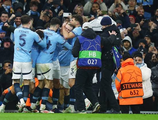 Erling Haaland of Manchester City celebrates scoring a goal from the penalty spot to make it 2-1 with their team-mates Manchester City v Real Madrid, UEFA Champions League, Knockout Round Play-offs, First Leg, Football, Etihad Stadium, Manchester, UK - 11 Feb 2025 EDITORIAL USE ONLY No use with unauthorised audio, video, data, fixture lists, club league logos or live services. Online in-match use limited to 120 images, no video emulation. No use in betting, games or single club league player publications. Copyright: xJavierxGarcia Shutterstockx 15136820ar