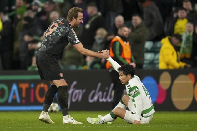 Harry Kane of Bayern Munich picked up dejected Reo Hatate of Celtic after final whistle Celtic v Bayern Munich, UEFA Champions League, Knockout Round Play-offs, First Leg, Football, Celtic Park, Glasgow, UK - 12 Feb 2025 EDITORIAL USE ONLY No use with unauthorised audio, video, data, fixture lists, club league logos or live services. Online in-match use limited to 120 images, no video emulation. No use in betting, games or single club league player publications. Copyright: xStuartxWallace Shutterstockx 15136907ej