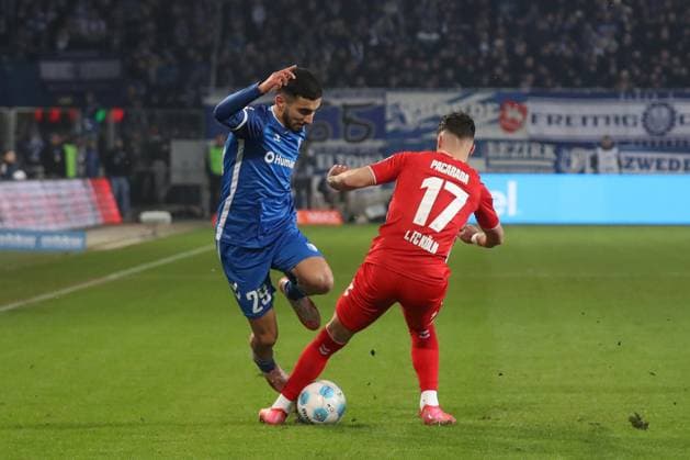 14.02.2025, xgox, Fussball 2. Bundesliga, 1. FC Magdeburg - 1. FC Koeln emspor, v.l. Livian Burcu (Magdeburg, 29), Dejan Ljubicic (Koeln, 7) Zweikampf, Duell, Kampf, tackle (DFL DFB REGULATIONS PROHIBIT ANY USE OF PHOTOGRAPHS as IMAGE SEQUENCES and or QUASI-VIDEO) Magdeburg