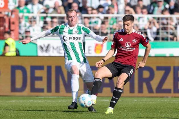 Simon Scherder (SC Preussen Muenster) und Stefanos Tzimas (1. FC Nuernberg) kaempfen um den Ball, 2. Bundesliga, Preußen Münster vs 1. FC Nürnberg, Preußenstadion am 09. March 2025 in Münster, Deutschland. (Foto von Marco Steinbrenner DeFodi Images) Simon Scherder (SC Preussen Muenster) und Stefanos Tzimas (1. FC Nuernberg) battle for the ball, 2. Bundesliga, Preußen Münster vs 1. FC Nürnberg, Preußenstadion, March 9, 2025 in Münster, Germany. (Photo by Marco Steinbrenner DeFodi Images) DFB DFL REGULATIONS PROHIBIT ANY USE OF PHOTOGRAPHS AS IMAGE SEQUENCES AND OR QUASI-VIDEO.