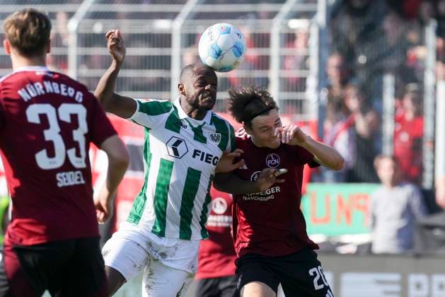 David Kinsombi (SC Preussen Muenster) und Caspar Jander (1. FC Nuernberg) kaempfen um den Ball, 2. Bundesliga, Preußen Münster vs 1. FC Nürnberg, Preußenstadion am 09. March 2025 in Münster, Deutschland. (Foto von Marco Steinbrenner DeFodi Images) David Kinsombi (SC Preussen Muenster) und Caspar Jander (1. FC Nuernberg) battle for the ball, 2. Bundesliga, Preußen Münster vs 1. FC Nürnberg, Preußenstadion, March 9, 2025 in Münster, Germany. (Photo by Marco Steinbrenner DeFodi Images) DFB DFL REGULATIONS PROHIBIT ANY USE OF PHOTOGRAPHS AS IMAGE SEQUENCES AND OR QUASI-VIDEO.