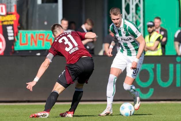 Robin Knoche (1. FC Nuernberg) und Holmbert Fridjonsson (SC Preussen Muenster) kaempfen um den Ball, 2. Bundesliga, Preußen Münster vs 1. FC Nürnberg, Preußenstadion am 09. March 2025 in Münster, Deutschland. (Foto von Marco Steinbrenner DeFodi Images) Robin Knoche (1. FC Nuernberg) und Holmbert Fridjonsson (SC Preussen Muenster) battle for the ball, 2. Bundesliga, Preußen Münster vs 1. FC Nürnberg, Preußenstadion, March 9, 2025 in Münster, Germany. (Photo by Marco Steinbrenner DeFodi Images) DFB DFL REGULATIONS PROHIBIT ANY USE OF PHOTOGRAPHS AS IMAGE SEQUENCES AND OR QUASI-VIDEO.