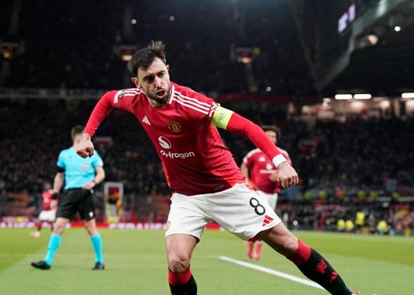 Manchester, England, 13th March 2025. Bruno Fernandes of Manchester United, ManU celebrates scoring the equalising penalty during the UEFA Europa League match Manchester United v Real Sociedad at Old Trafford, Manchester. Picture credit should read: Andrew Yates Sportimage EDITORIAL USE ONLY. No use with unauthorised audio, video, data, fixture lists, club league logos or live services. Online in-match use limited to 120 images, no video emulation. No use in betting, games or single club league player publications. SPI_026_AY_MANU_SOCIEDAD SPI-3744-0026