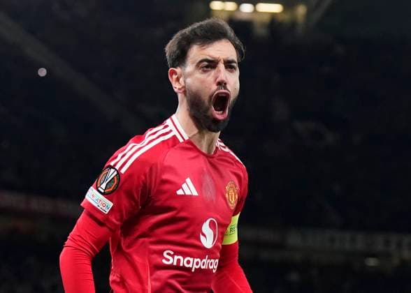 Manchester, England, 13th March 2025. Bruno Fernandes of Manchester United, ManU celebrates scoring the equalising penalty during the UEFA Europa League match Manchester United v Real Sociedad at Old Trafford, Manchester. Picture credit should read: Andrew Yates Sportimage EDITORIAL USE ONLY. No use with unauthorised audio, video, data, fixture lists, club league logos or live services. Online in-match use limited to 120 images, no video emulation. No use in betting, games or single club league player publications. SPI_029_AY_MANU_SOCIEDAD SPI-3744-0029