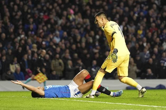 Irfan Can Egribayat of Fenerbahce SK berates Cyriel Dessers of Rangers as they lie on the ground in the penalty area Rangers v Fenerbahce, UEFA Europa League, Round of 16, Second Leg, Football, Ibrox Stadium, Glasgow, Scotland, UK - 13 Mar 2025 EDITORIAL USE ONLY No use with unauthorised audio, video, data, fixture lists, club league logos or live services. Online in-match use limited to 120 images, no video emulation. No use in betting, games or single club league player publications. Copyright: xStuartxWallace Shutterstockx 15188226bj