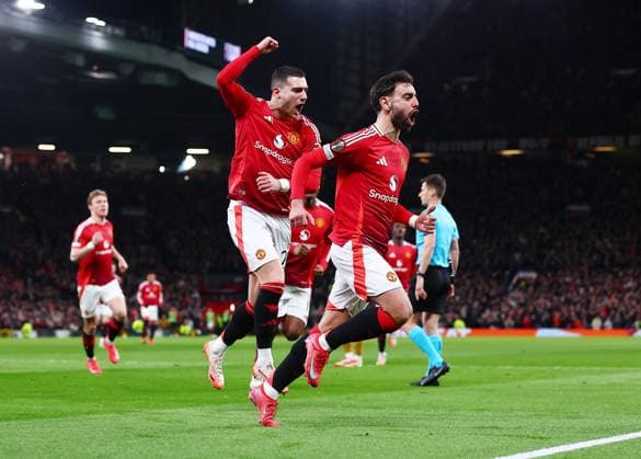 Bruno Fernandes of Manchester United, ManU celebrates scoring a goal from the penalty spot to make it 2-1 with Diogo Dalot Manchester United v Real Sociedad, UEFA Europa League, Round of 16, Second Leg, Football, Old Trafford, Manchester, UK - 13 Mar 2025 EDITORIAL USE ONLY No use with unauthorised audio, video, data, fixture lists, club league logos or live services. Online in-match use limited to 120 images, no video emulation. No use in betting, games or single club league player publications. Copyright: xMattxWest Shutterstockx 15188208bk
