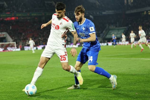 GER, 2.FBL, 1. FC Koeln vs. SV Darmstadt 98 15.03.2025, Rheinenergie Stadion, Koeln, GER, 2.FBL, 1. FC Koeln vs. SV Darmstadt 98, im Bild: Jusuf Gazibegovic (Koeln 25), im Zweikampf gegen Killian Corredor (Darmstadt 98 34),