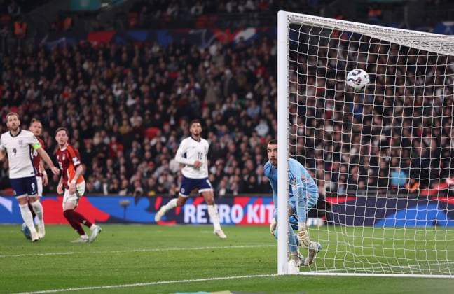 London, England, 24th March 2025. Krisjanis Zviedris of Latvia can only look on as the free kick from Reece James of England sails into the net for the first goal during the FIFA World Cup, WM, Weltmeisterschaft, Fussball European Qualifying match at Wembley Stadium, London. Picture credit should read: David Klein Sportimage EDITORIAL USE ONLY. No use with unauthorised audio, video, data, fixture lists, club league logos or live services. Online in-match use limited to 120 images, no video emulation. No use in betting, games or single club league player publications. SPI_031_DK_England_Latvia SPI-3762-0031