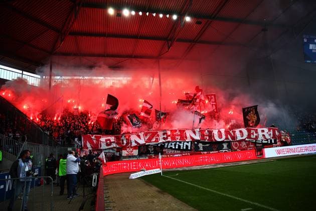 06.04.2025, xmohx, Fussball 2.Bundesliga, 1.FC Magdeburg - 1.FC Kaiserslautern v.l. Emotionen, Fans, Stimmung, Fahnen, Logo, 1. FC Kaiserslautern, rot weiss, teufel zuenden Pyrotechnik (DFL DFB REGULATIONS PROHIBIT ANY USE OF PHOTOGRAPHS as IMAGE SEQUENCES and or QUASI-VIDEO) Magdeburg