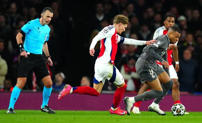 Martin Odegaard of Arsenal and Kylian Mbappà of Real Madrid in action Arsenal v Real Madrid, UEFA Champions League, Quarter Final, First Leg, Football, Emirates Stadium, London, UK - 08 Apr 2025 EDITORIAL USE ONLY No use with unauthorised audio, video, data, fixture lists, club league logos or live services. Online in-match use limited to 120 images, no video emulation. No use in betting, games or single club league player publications. Copyright: xJavierxGarcia Shutterstockx 15243595v