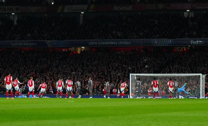Declan Rice of Arsenal scores a goal to make the score 2-0 past Real Madrid Goalkeeper Thibaut Courtois Arsenal v Real Madrid, UEFA Champions League, Quarter Final, First Leg, Football, Emirates Stadium, London, UK - 08 Apr 2025 EDITORIAL USE ONLY No use with unauthorised audio, video, data, fixture lists, club league logos or live services. Online in-match use limited to 120 images, no video emulation. No use in betting, games or single club league player publications. Copyright: xJavierxGarcia Shutterstockx 15243595at