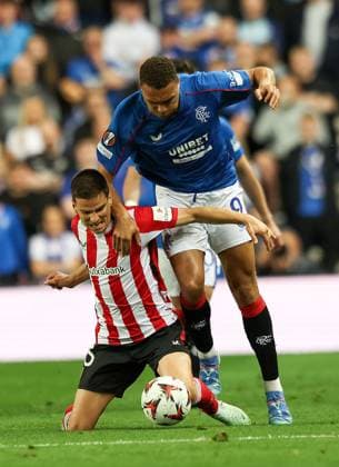 Cyriel Dessers of Rangers in action with Inigo Ruiz de Galarreta of Athletic Bilbao during UEFA Europa League Quarter-Final first leg match at Ibrox Stadium, Glasgow. Rangers v Athletic Bilbao, UEFA Europa League, Quarter Final, First Leg, Football, Ibrox Stadium, Glasgow, Scotland, UK - 10 Apr 2025 EDITORIAL USE ONLY No use with unauthorised audio, video, data, fixture lists, club league logos or live services. Online in-match use limited to 120 images, no video emulation. No use in betting, games or single club league player publications. Copyright: xRangersxFC Shutterstockx 15247737bd