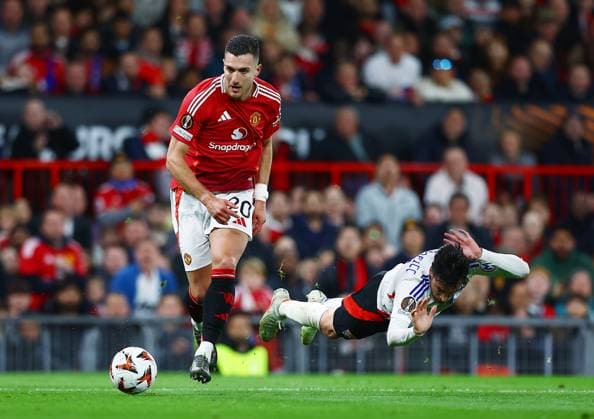 Diogo Dalot of Manchester United, ManU and Nicolas Tagliafico of Lyon Manchester United v Olympique Lyonnais, UEFA Europa League, Quarter Final, Second Leg, Football, Old Trafford, Manchester, UK - 17 Apr 2025 EDITORIAL USE ONLY No use with unauthorised audio, video, data, fixture lists, club league logos or live services. Online in-match use limited to 120 images, no video emulation. No use in betting, games or single club league player publications. Copyright: xMattxWest Shutterstockx 15253946ak