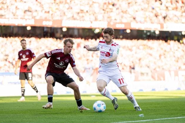 Florian Kainz (FC Koeln, 11) im Zweikampf, GER, 1. FC Nuernberg (FCN) vs 1. FC Koeln (KOE), Fussball 2. Bundesliga, 33. Spieltag, Saison 2024 2025, 09.05.2025 DFB DFL regulations prohibit any use of photographs as image sequences and or quasi-video GER, 1. FC Nuernberg (FCN) vs 1. FC Koeln (KOE), Fussball 2. Bundesliga, 33. Spieltag, Saison 2024 2025, 09.05.2025 Nuernberg