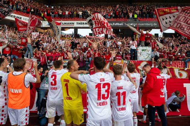 Marvin Schwaebe (FC Koeln, 01), Mark Uth (FC Koeln, 13), Florian Kainz (FC Koeln, 11), Dominique Heintz (FC Koeln, 03) und Team jubeln ueber den Sieg und feiern mit den Fans Ultras im Gaesteblock den moeglichen Aufstieg, GER, 1. FC Nuernberg (FCN) vs 1. FC Koeln (KOE), Fussball 2. Bundesliga, 33. Spieltag, Saison 2024 2025, 09.05.2025 DFB DFL regulations prohibit any use of photographs as image sequences and or quasi-video GER, 1. FC Nuernberg (FCN) vs 1. FC Koeln (KOE), Fussball 2. Bundesliga, 33. Spieltag, Saison 2024 2025, 09.05.2025 Nuernberg