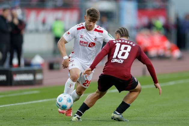 v.l. Jan Thielmann (1. FC Koeln, 29) und Rafael Lubach (1.FC Nuernberg, 18), 09.05.2025, Fussball, 2. Bundesliga, 1. FC Nürnberg - 1. FC Köln, GER, Nuernberg, Max-Morlock-Stadion, DFL REGULATIONS PROHIBIT ANY USE OF PHOTOGRAPHS AS IMAGE SEQUENCES AND OR QUASI-VIDEO.