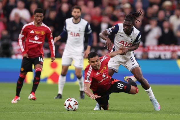 Bilbao, Spain, 21st May 2025. Casemiro of Manchester United, ManU and Yves Bissouma of Tottenham challenge for the ball during the Tottenham Hotspur vs Manchester United UEFA Europa League Final match at San Mames, Bilbao. Picture credit should read: David Klein Sportimage EDITORIAL USE ONLY. No use with unauthorised audio, video, data, fixture lists, club league logos or live services. Online in-match use limited to 120 images, no video emulation. No use in betting, games or single club league player publications. SPI_058_DK_Tottenham_Man_Utd SPI-3943-0058