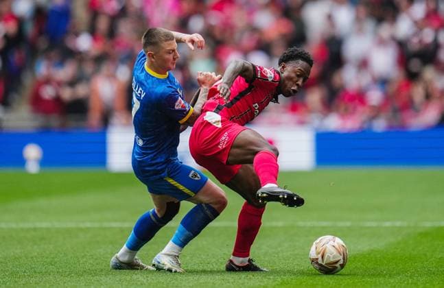 James Tilley of AFC Wimbledon and Liam Gordon of Walsall AFC Wimbledon v Walsall, EFL Sky Bet League Two, Play-Off Final, Football, Wembley Stadium, London, UK - 26 May 2025 EDITORIAL USE ONLY No use with unauthorised audio, video, data, fixture lists, club league logos or live services. Online in-match use limited to 120 images, no video emulation. No use in betting, games or single club league player publications. Copyright: xJoexToth Shutterstockx 15316459ba
