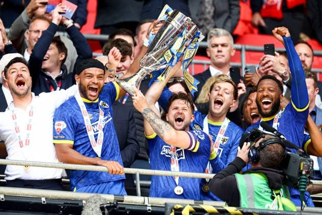 AFC Wimbledon lift the Sky Bet League Two Play-Off Final trophy AFC Wimbledon v Walsall, EFL Sky Bet League Two, Play-Off Final, Football, Wembley Stadium, London, UK - 26 May 2025 EDITORIAL USE ONLY No use with unauthorised audio, video, data, fixture lists, club league logos or live services. Online in-match use limited to 120 images, no video emulation. No use in betting, games or single club league player publications. Copyright: xSimonxDael Shutterstockx 15316455fm