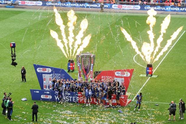 AFC Wimbledon lift the Sky Bet League Two Play-Off Final trophy AFC Wimbledon v Walsall, EFL Sky Bet League Two, Play-Off Final, Football, Wembley Stadium, London, UK - 26 May 2025 EDITORIAL USE ONLY No use with unauthorised audio, video, data, fixture lists, club league logos or live services. Online in-match use limited to 120 images, no video emulation. No use in betting, games or single club league player publications. Copyright: xIanxTuttle Shutterstockx 15316456di